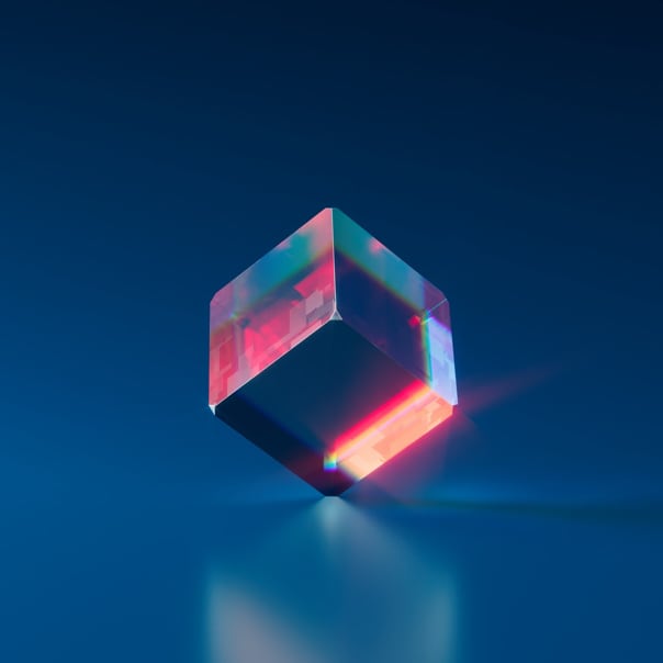 image of a glass cube against blue background